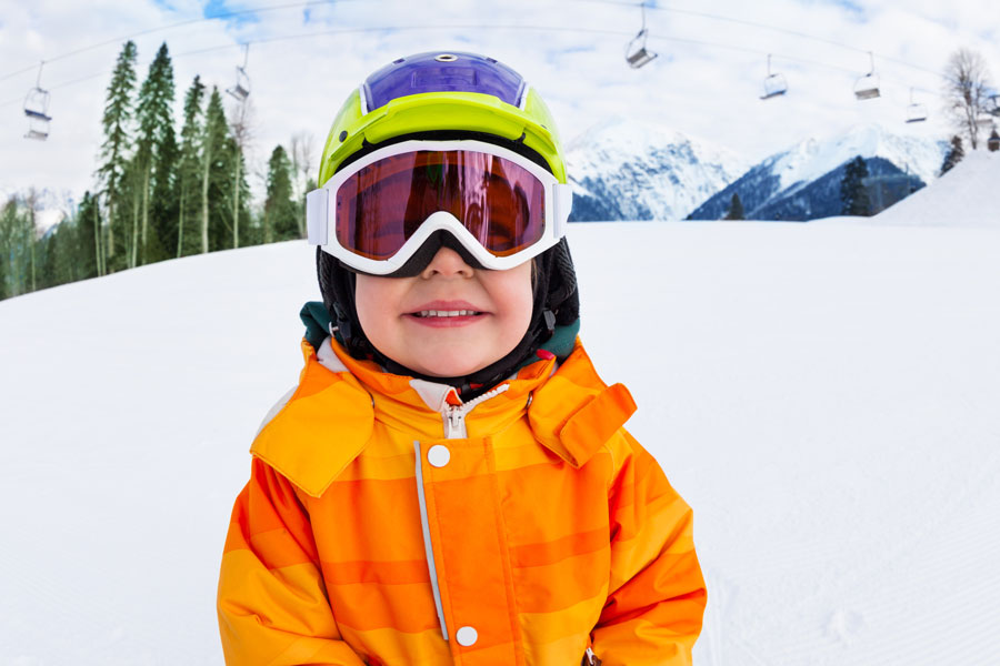 child wearing snow goggles