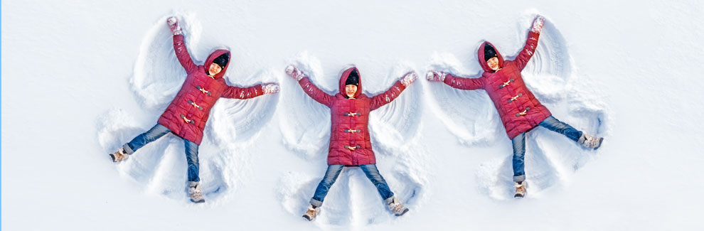 children making snow angels